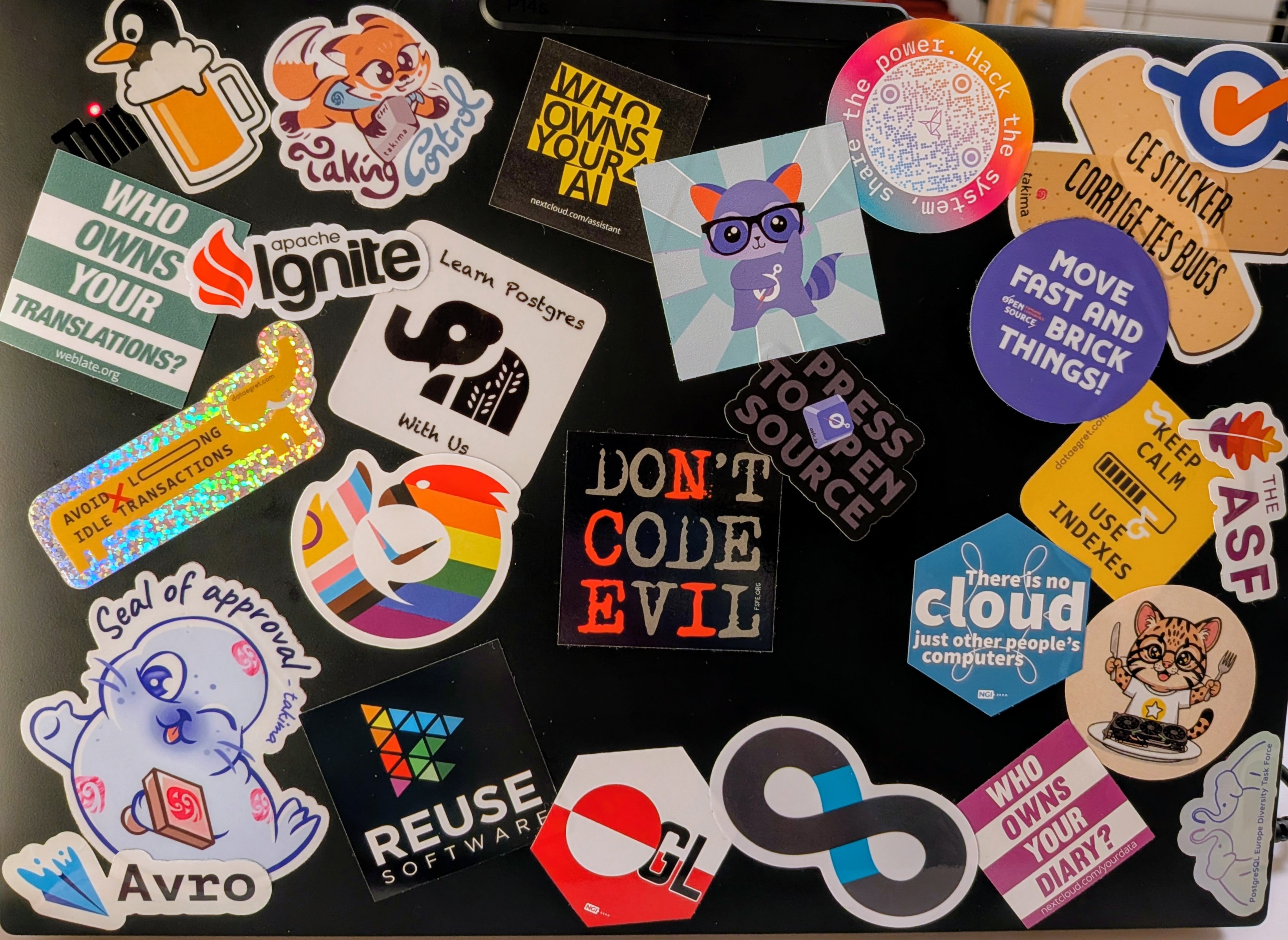 FOSDEM 2025 sticker collection on laptop